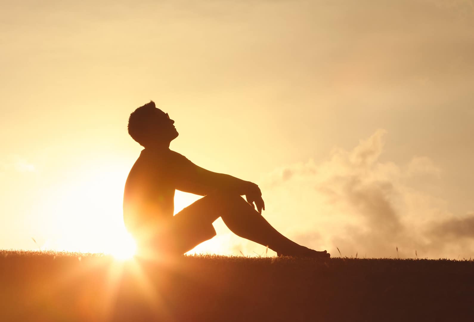 Man silhouetted against sunrise representing hope and healing through IV ketamine therapy for depression at Better Health Whole Wellness Center Philadelphia